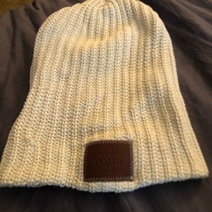 Love Your Melon white beanie with leather tag